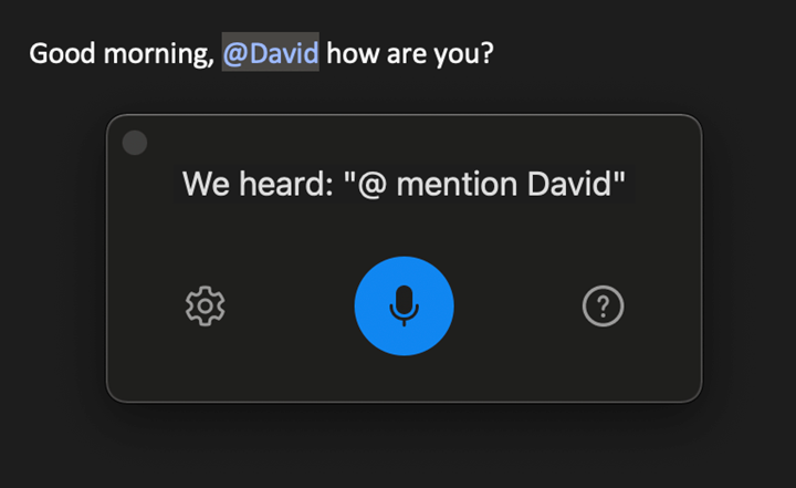 Screenshot of voice dictation (@mention) in Outlook.