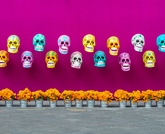 Day of the Dead display of paper-mache skulls.