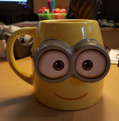 Coffee mug based on "Minions" movie character.