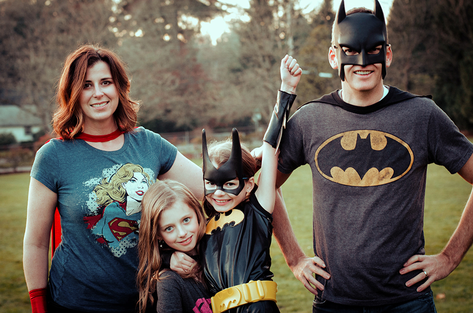 Clint Covington and his family dressed up in superhero costumes.